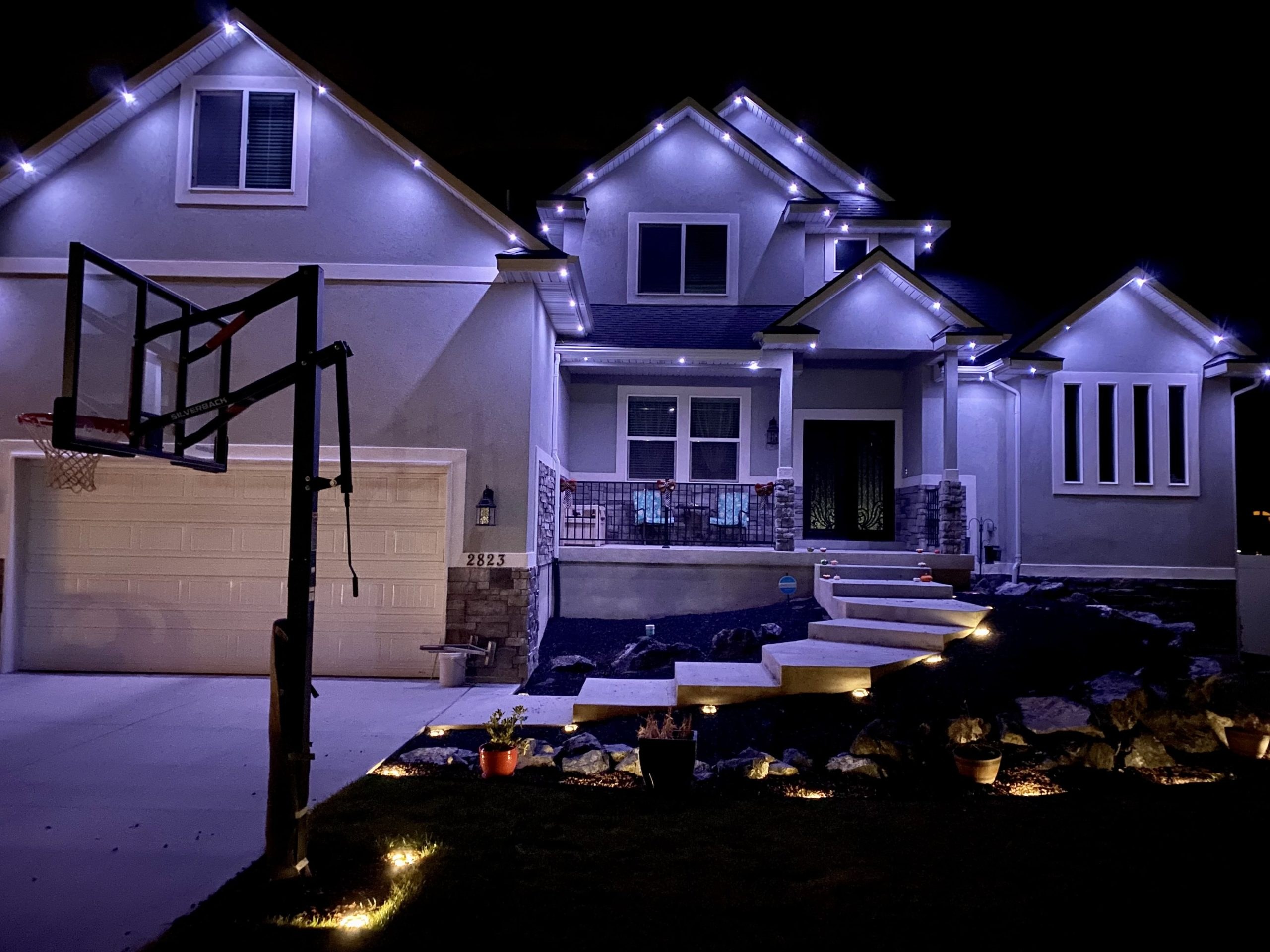 Modern home with recessed-look permanent roofline LEDs