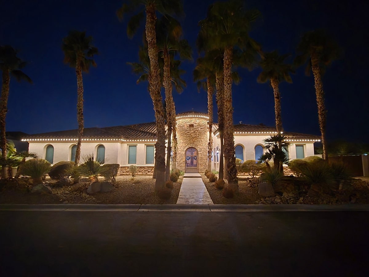 Stone façade with permanent warm-white roofline LEDs