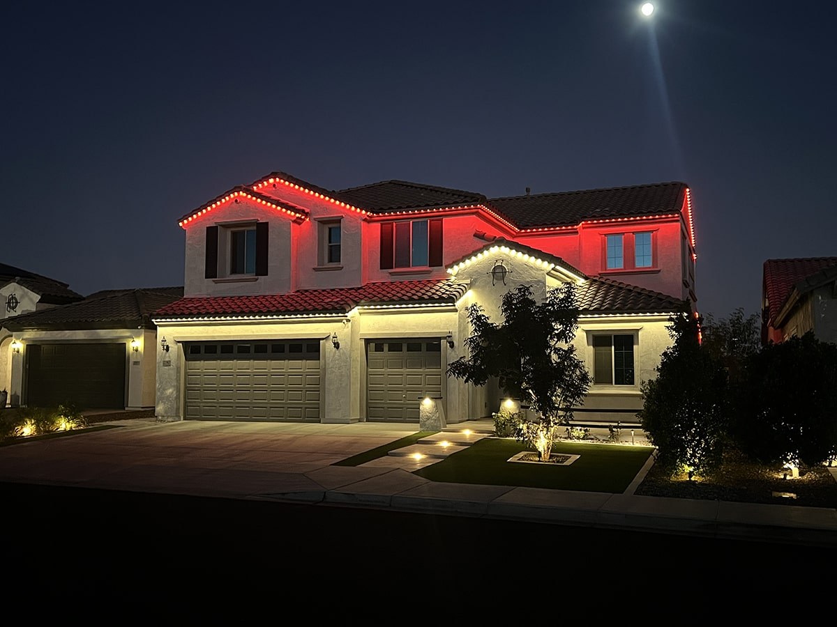 Two-story home with true-white roofline and red accent LEDs