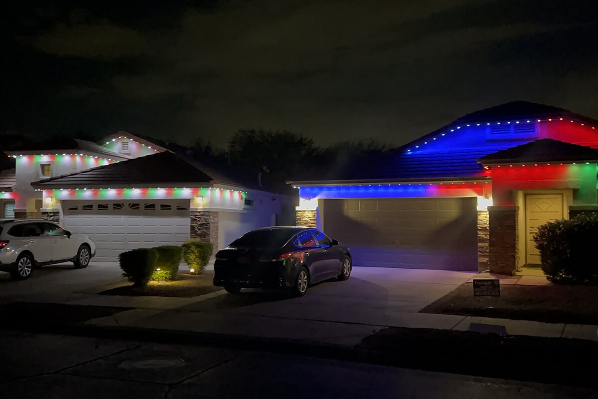 Home with custom red, blue, and green roofline lighting zones